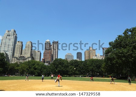 NEW YORK CITY - JULY 18:Softball teams playing at Heckscher Ballfields in Central Park on July 18, 2013.There are 26 softball and baseball fields open to the public in Central Park