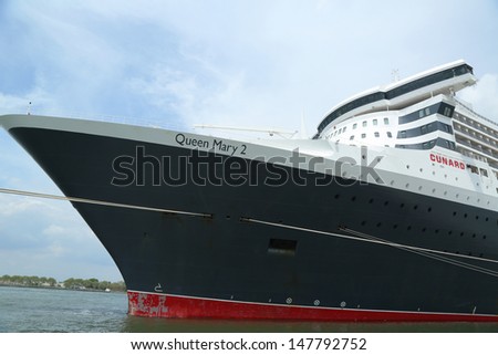 NEW YORK CITY - JULY 27: Queen Mary 2 cruise ship docked at Brooklyn Cruise Terminal on July 27, 2013. Queen Mary 2 is CunardÃ¢Â?Â?s flagship ready for Transatlantic Crossing  from New York to  Southampton