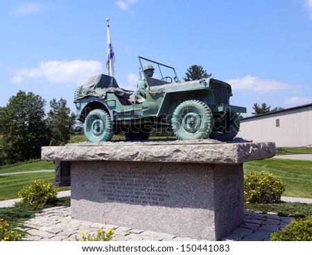 BANGOR, MAINE - JULY 4: Maine State World War II Memorial in Bangor, ME on July 4, 2013.  It is an exact bronze casting of the Cole Land Transportation Museum WWII Willis Jeep