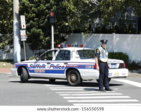 HUNTINGTON, NY - SEPTEMBER 9  Suffolk County Police Department officer providing security during parade in Huntington, NY  on September 9, 2013