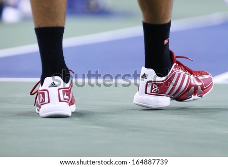 NEW YORK -AUGUST 27 Six times Grand Slam champion Novak Djokovic wears custom Adidas tennis shoes during match at US Open 2013 at Billie Jean King National Tennis Center on August 27, 2013 in New York