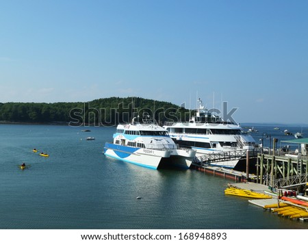 BAR HARBOR, MAINE - JULY 4: Sea kayaks and whale watching boats ready for tourists in Bar Harbor on July 4, 2013. Bar Harbor is a famous summer colony in the Down East region of Maine