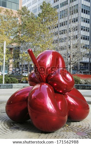 NEW YORK - NOVEMBER 10: Red Balloon Flower by Jeff Koons at 7 World Trade Center on November 10, 2013. It is one of Koons\' signature highly polished, public stainless steel sculptures