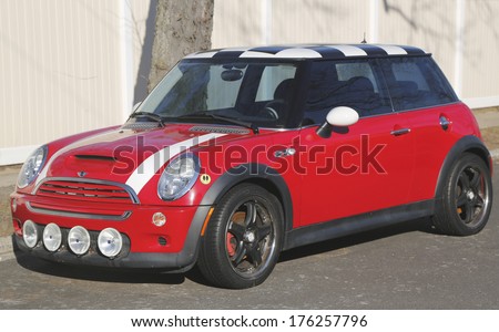 BROOKLYN, NEW YORK - JANUARY 9: Mini Cooper Hardtop car in Brooklyn on January 9, 2014. In 1999 the Mini was voted the second most influential car of the 20th century, behind the Ford Model T