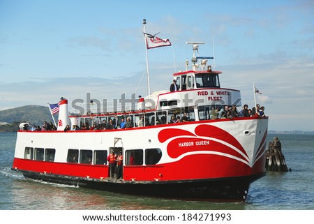 SAN FRANCISCO,CA - MARCH 28: Red and White Fleet boat docking at Pier 43 in Fisherman\'s Wharf on March 28, 2013. It offers sailings under the Golden Gate Bridge and around Alcatraz since 1892