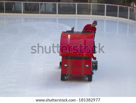 NEW YORK - MARCH 20: Ice resurfacing at the Ice  Rink at Rockefeller Center in midtown Manhattan on March 20, 2014. An ice resurfacer is a vehicle used to clean and smooth the surface of an ice rink