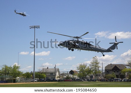 FREEPORT, NEW YORK - MAY 25  MH-60S helicopter from Helicopter Sea Combat Squadron Five with US Navy EOD team taking off after mine countermeasures demonstration during Fleet Week 2014 on May 25, 2014