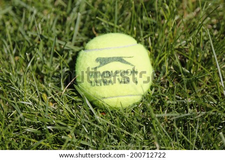 NEW YORK - JUNE 22  Slazenger Wimbledon Tennis Ball on grass tennis court on June, 22, 2014 in New York  Slazenger Wimbledon Tennis Ball exclusively used and endorsed by The Championships, Wimbledon