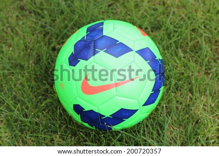 NEW YORK - JUNE 24 Nike soccer ball on grass in New York on June 24, 2014 Nike is an American multinational corporation that is engaged in the design, development and manufacturing of sport goods