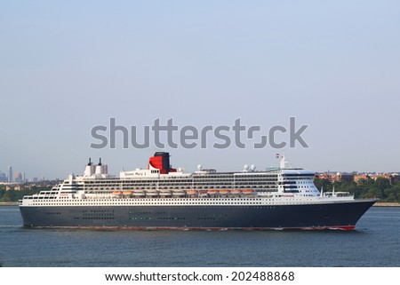 NEW YORK CITY - JULY 1: Queen Mary 2 cruise ship in New York Harbor heading for Canada and New England  on July 1, 2014