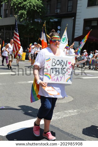 NEW YORK - June 29, 2014: LGBT Pride Parade participant in New York City on June 29, 2014. LGBT pride march takes place during pride week and is the culmination of week long festivities