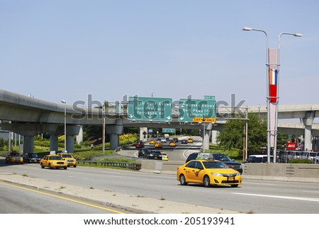 NEW YORK - JULY 10: New York Taxi at Van Wyck Expressway entering JFK International Airport in New York on July 10, 2014.JFK is the busiest international air passenger gateway in the United States
