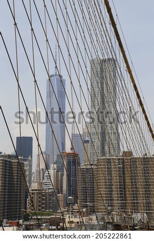 NEW YORK - JUNE 17 Freedom Tower and Beekman Tower view from the Brooklyn Bridge on June 17, 2014 The Brooklyn Bridge is an icon of New York and was designated a National Historic Landmark in 1964