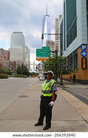 NEW YORK - JULY 17: NYPD Traffic Control Police Officer near Freedom Tower in Manhattan on July 17, 2014