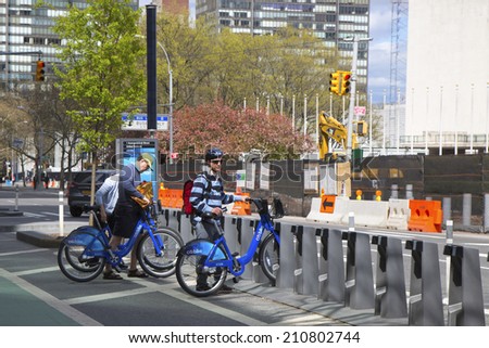 NEW YORK CITY - APRIL 27: Unidentified bike rider renting Citi bike in Manhattan on April 27, 2014. NYC bike share system started in Manhattan and Brooklyn on May 27, 2013