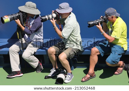 NEW YORK - AUGUST 25 Professional photographers at  US Open 2014 at Billie Jean King National Tennis Center on August 25, 2014 in New York