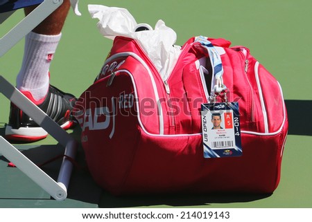 NEW YORK - AUGUST 24 Six times Grand Slam champion Novak Djokovic customized Head tennis bag at US Open 2014 at Billie Jean King National Tennis Center on August 24, 2014 in New York