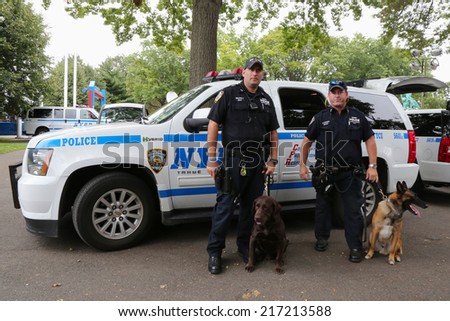 NEW YORK - SEPTEMBER 8: NYPD transit bureau K-9 police officers and K-9 dogs providing security at National Tennis Center during US Open 2014 on September 8, 2014 in New York