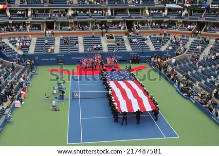 NEW YORK- SEPTEMBER 8  US Marine Corps unfurling American Flag  during the opening ceremony of the US Open 2014 men final at Billie Jean King National Tennis Center on September 8, 2014 in New York
