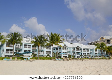 GRAND CAYMAN - JUNE 12: Luxury condominium located on the Seven Miles Beach at Grand Cayman on June 12, 2014. Seven Mile Beach is the most populated area for hotels and resorts on the island
