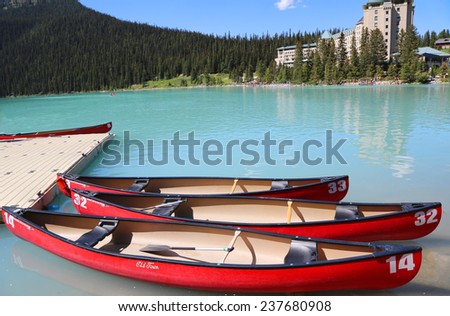 LAKE LOUISE, CANADA - JULY 27:Canoes on beautiful turquoise Lake Louise on July 27, 2014. Lake Louise is the second most-visited destination in the Banff National Park.