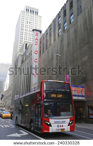 NEW YORK - DECEMBER 18: Open Loop Tour New York Hop on Hop off bus in the front of New York City landmark Radio City Music Hall in midtown Manhattan on December 18, 2014.