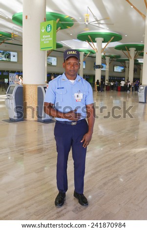 PUNTA CANA, DOMINICAN REPUBLIC -JANUARY 4: CESAC officer providing security at Punta Cana Airport on January 4, 2015. CESAC is Executive Specialized in Airport Security Body of Dominican Republic Army