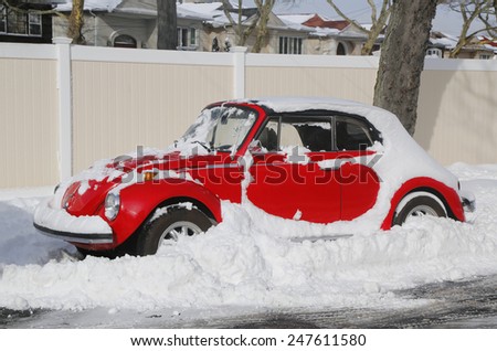 BROOKLYN, NEW YORK - JANUARY 27, 2015: Car under snow in Brooklyn, NY after massive Winter Storm Juno strikes Northeast.