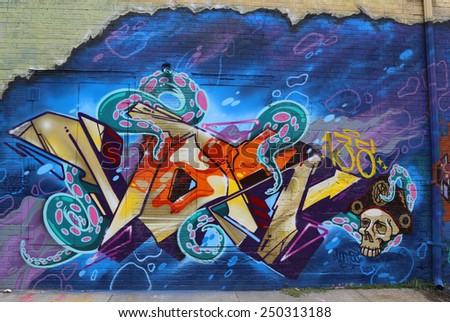NEW YORK - JULY 24, 2014: Mural art in Astoria section in Queens. A mural is any piece of artwork painted or applied directly on a wall, ceiling or other large permanent surface