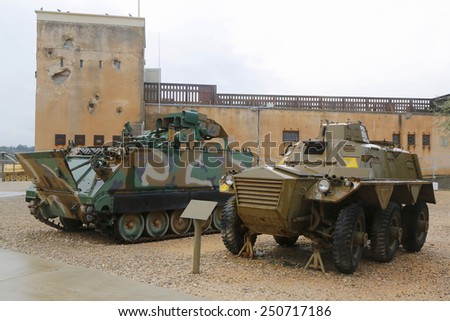 LATRUN, ISRAEL - NOVEMBER 27, 2014: American made M901 Improved TOW Vehicle (left) and  FV603 Saracen six-wheeled armored personnel carrier (right) on display at Yad La-Shiryon Armored Corps Museum