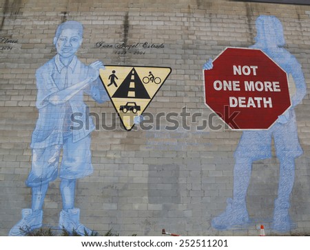 NEW YORK - NOVEMBER 13, 2014:Mural Not One More Death in Park Slope section of Brooklyn. A mural is any piece of artwork painted or applied directly on a wall, ceiling or other large permanent surface