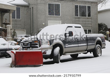 BROOKLYN, NEW YORK - MARCH 1, 2015: Snow plow truck in Brooklyn, NY ready to clean streets after massive Winter Storm Sparta strikes Northeast
