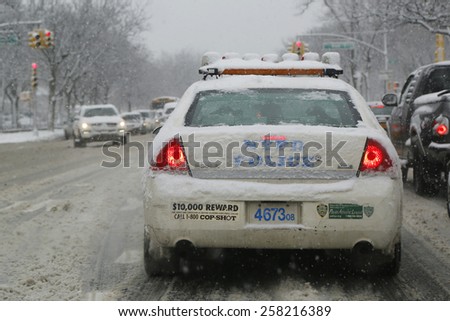BROOKLYN, NEW YORK - MARCH 5, 2015: NYPD car in Brooklyn, NY during massive Winter Storm Thor