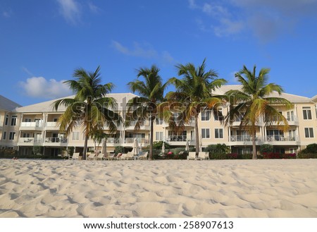 GRAND CAYMAN - JUNE 11, 2014: Luxury condominium located on the Seven Miles Beach at Grand Cayman. Seven Mile Beach is the most populated area for hotels and resorts on the island