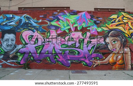 NEW YORK - MAY 12, 2015: Mural art at JMZ Walls in Brooklyn. A mural is any piece of artwork painted or applied directly on a wall, ceiling or other large permanent surface
