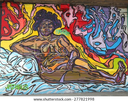 NEW YORK - MAY 12, 2015: Mural art at JMZ Walls in Brooklyn. A mural is any piece of artwork painted or applied directly on a wall, ceiling or other large permanent surface