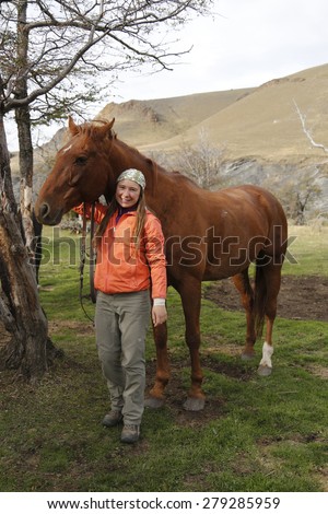 TORRES DEL PAINE, CHILE - APRIL 7, 2015: Tour guide with horse in National Park Torres del Paine, Patagonia, Chile