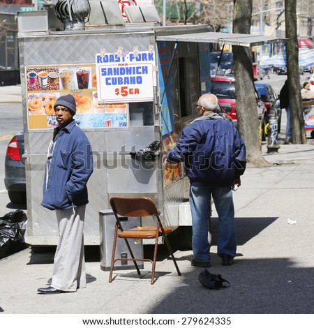 NEW YORK - APRIL 16, 2015:  Street vendor cart at Alphabet City in East Village, Lower Manhattan