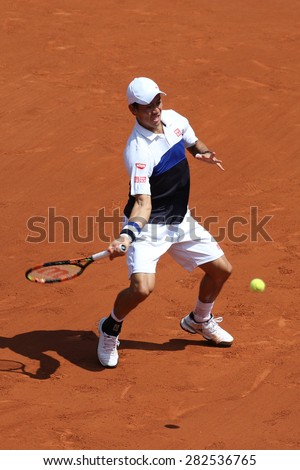 PARIS, FRANCE- MAY 27, 2015: Professional tennis player Kei Nishikori of Japan during second round match at Roland Garros 2015 in Paris, France
