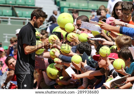 PARIS, FRANCE- MAY 23, 2015: Professional tennis player Gilles Simon of France signing autographs after practice for Roland Garros 2015 in Paris, France