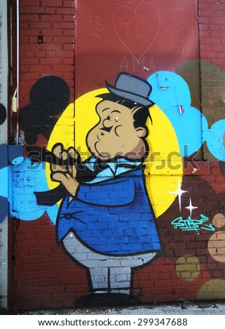 NEW YORK - JULY 23, 2015: Mural art at East Williamsburg in Brooklyn.Outdoor art gallery known as the Bushwick Collective has most diverse collection of street art in Brooklyn