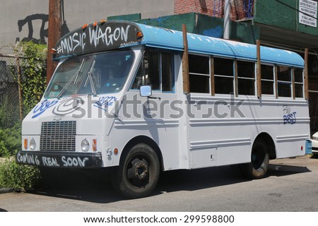 NEW YORK - JULY 23, 2015: Music Wagon covered with graffiti in Brooklyn. Outdoor art gallery known as the Bushwick Collective has most diverse collection of street art in Brooklyn