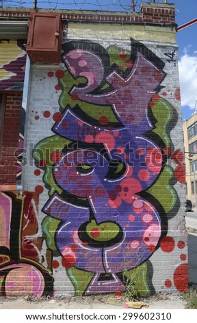 NEW YORK - JULY 23, 2015: Graffiti art at East Williamsburg in Brooklyn.Outdoor art gallery known as the Bushwick Collective has most diverse collection of street art in Brooklyn