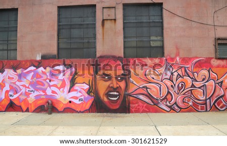 NEW YORK - JUNE 30, 2015: Mural art in Red Hook section of Brooklyn. A mural is any piece of artwork painted or applied directly on a wall, ceiling or other large permanent surface