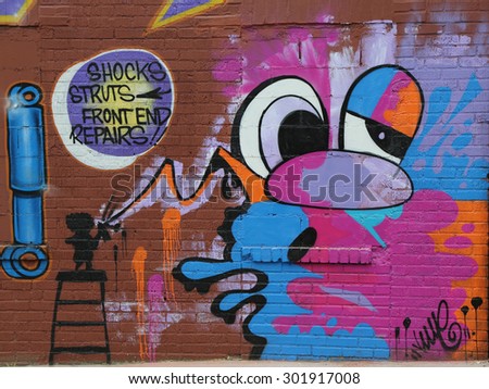 NEW YORK - MAY 21, 2015: Mural art in Staten Island, NY. A mural is any piece of artwork painted or applied directly on a wall, ceiling or other large permanent surface