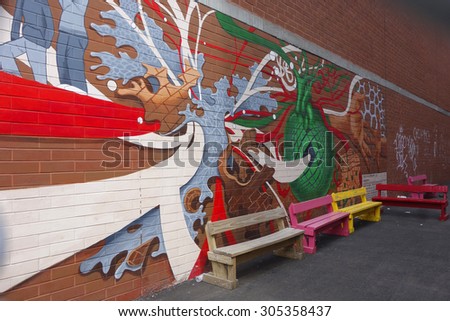 NEW YORK - AUGUST 8, 2015: Mural art in Little Italy in Manhattan. A mural is any piece of artwork painted or applied directly on a wall, ceiling or other large permanent surface