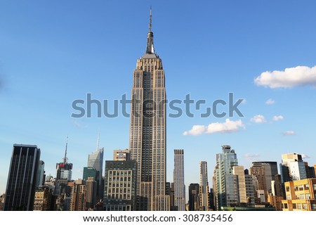 NEW YORK - AUGUST 1, 2015: Midtown Manhattan aerial view with Empire State Building. The Empire State Building is a 102-story landmark and was world\'s tallest building for more than 40 years.