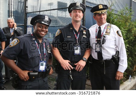 NEW YORK - SEPTEMBER 13, 2015: NYPD  police officers providing security at National Tennis Center during US Open 2015 finals in New York