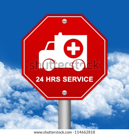 Hexagon Red Traffic Sign For Ambulance Car 24 HRS Service Against The Blue Sky Background