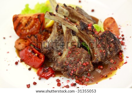 Lamb Rack - grilled,with sauce,peppercorn,baked tomato